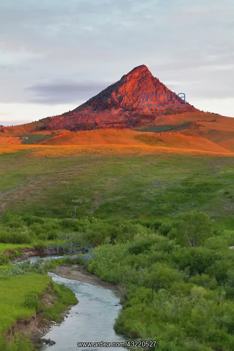 : Elk Creek runs below Haystack Butte at first : Elk Creek runs below Haystack Butte at first