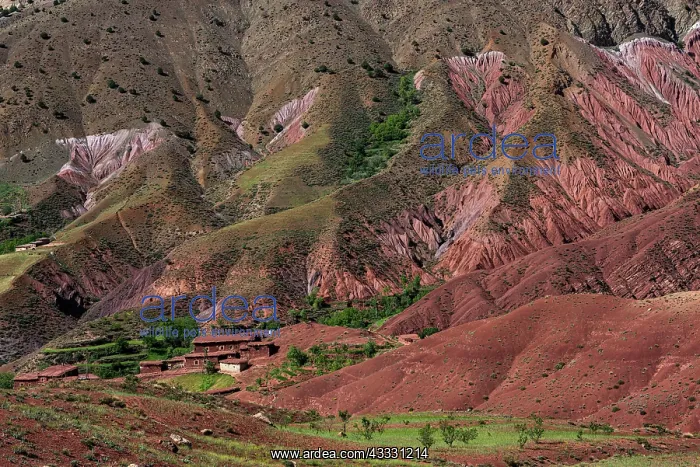 : Erosion landscape with small clay village of the : Erosion landscape with small clay village of the