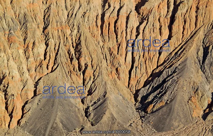 : Exposed fissured bedrock of reddish orange coloured : Exposed fissured bedrock of reddish orange coloured