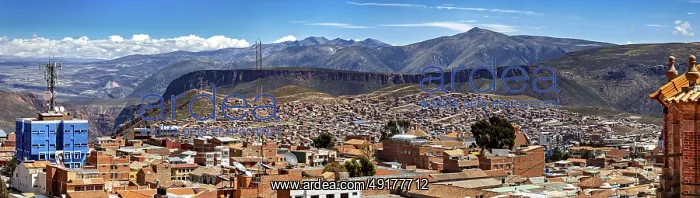 : Far-reaching panorama with cityscape and surrounding mountains under a clear sky : Far-reaching panorama with cityscape and surrounding mountains under a clear sky