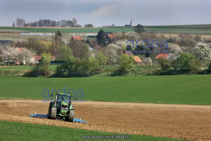  : Farming - agricultural landscape with tractor ploughing