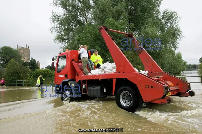 : Flooding - Lorry carrying sand bags driving along : Flooding - Lorry carrying sand bags driving along