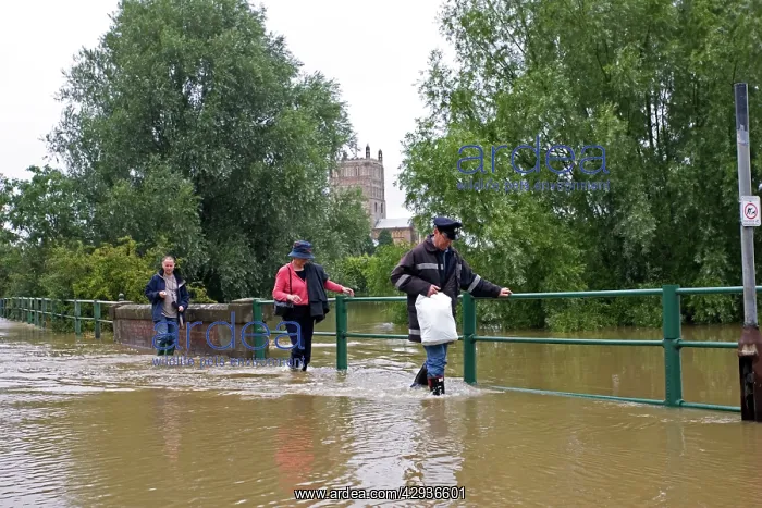 : Flooding - People walking along flooded road opposite : Flooding - People walking along flooded road opposite