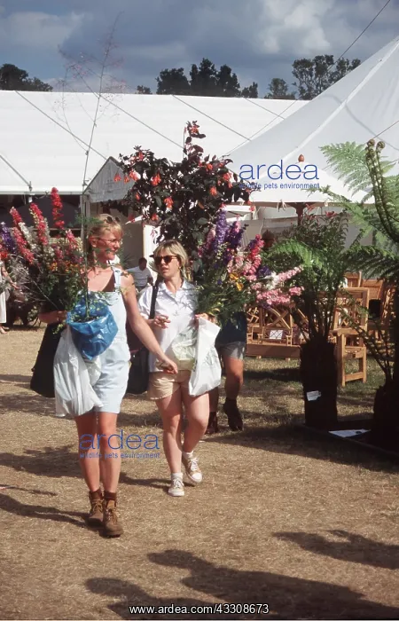 : FLOWER SHOW - women with flowers at hampton court : FLOWER SHOW - women with flowers at hampton court
