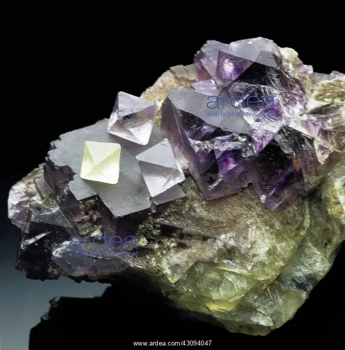 : Fluorite, a mineral composed of calcium fluoride (CaF2) : Fluorite, a mineral composed of calcium fluoride (CaF2)