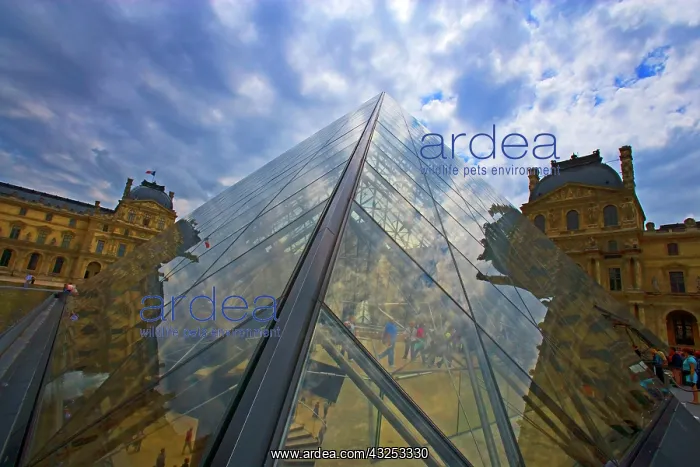  : France, Paris. Clouds reflect off the Louvre