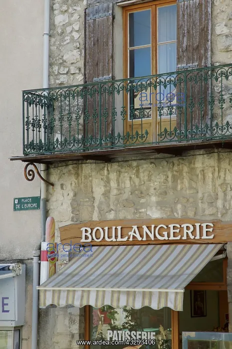 : France, Sault. A bakery sits beneath an : France, Sault. A bakery sits beneath an