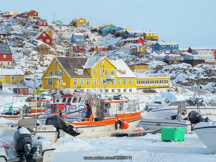 : The frozen harbor of Uummannaq during winter in : The frozen harbor of Uummannaq during winter in