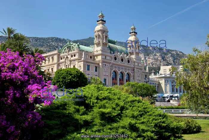 : Gardens surround the famous Monte Carlo : Gardens surround the famous Monte Carlo