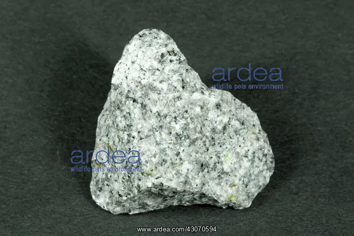 : Granite. Hand sample of Granite, a crystalline intrusive igneous rock consisting : Granite. Hand sample of Granite, a crystalline intrusive igneous rock consisting