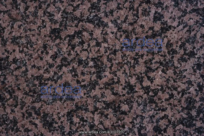 : Granite. Close-up of the cut surface of granite, showing an abundance of pink feldspar : Granite. Close-up of the cut surface of granite, showing an abundance of pink feldspar