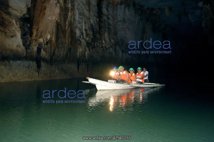 : A group of tourists on a boat with a guide - inside : A group of tourists on a boat with a guide - inside