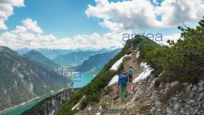 : Two hikers on hiking trail, crossing from Seekarspitz : Two hikers on hiking trail, crossing from Seekarspitz