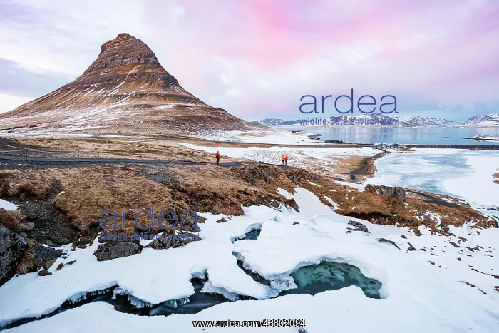 : Hikers, Kirkjufell mountain, Kirkjufellfoss waterfall : Hikers, Kirkjufell mountain, Kirkjufellfoss waterfall