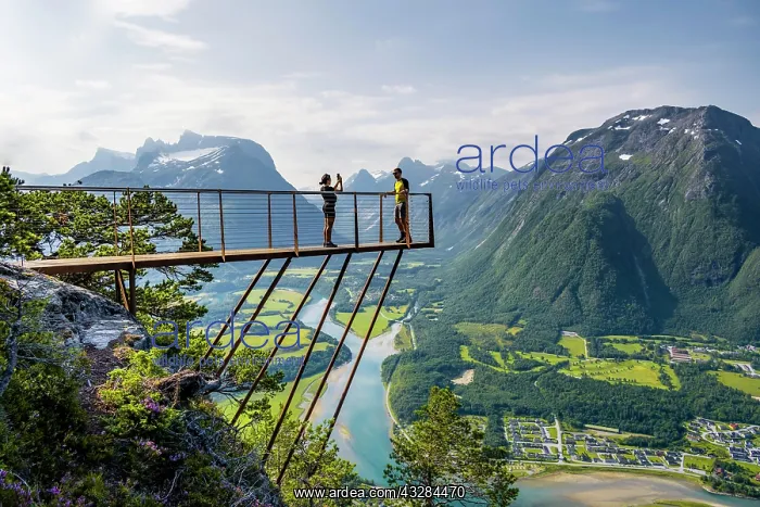 : Hikers standing on viewing platform Rampestreken : Hikers standing on viewing platform Rampestreken