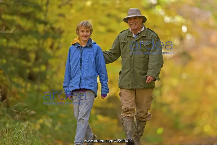 : Hiking - father and son walking alongside American : Hiking - father and son walking alongside American