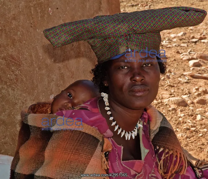: Himba lady with child - some of the tribe no longer : Himba lady with child - some of the tribe no longer