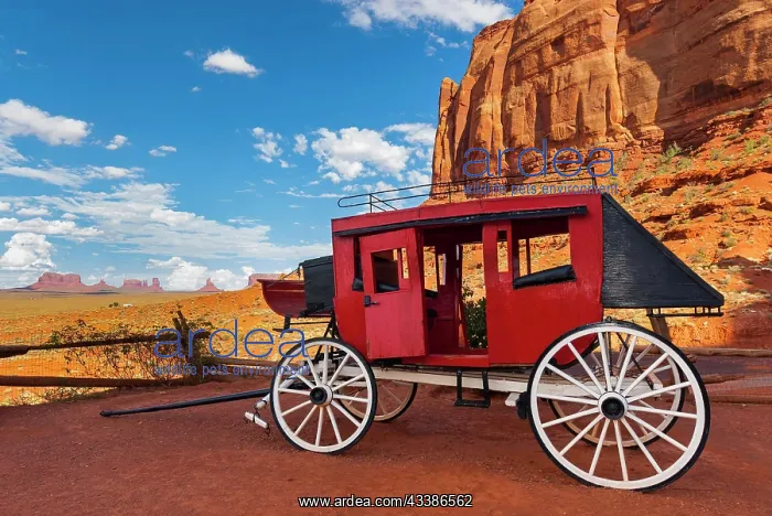 : Historic carriage at Monument Valley, cloudy sky : Historic carriage at Monument Valley, cloudy sky