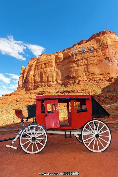  : Historic carriage at Monument Valley, cloudy sky