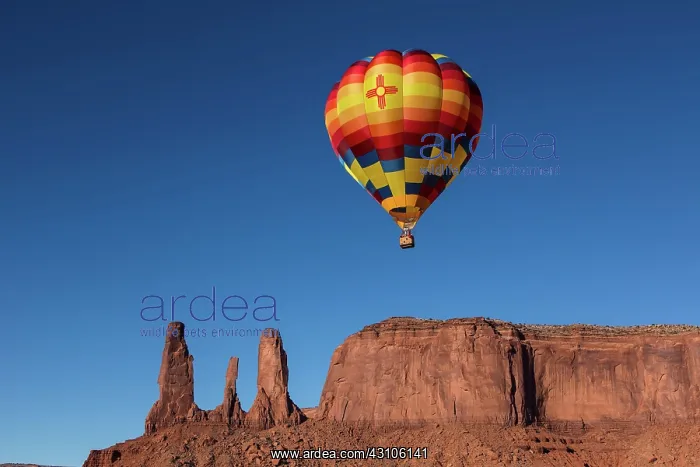 : Hot air balloon flies in front of the Three Sisters : Hot air balloon flies in front of the Three Sisters