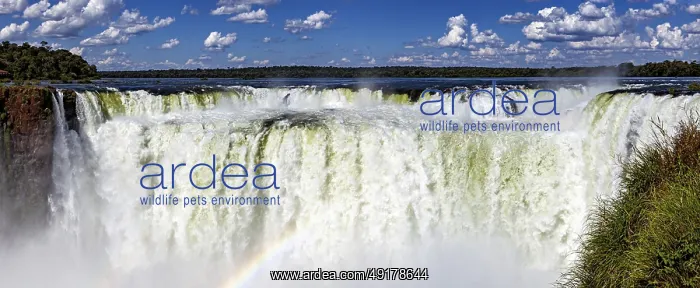 : Impressive panoramic view of a chain of waterfalls under a cloudy sky : Impressive panoramic view of a chain of waterfalls under a cloudy sky