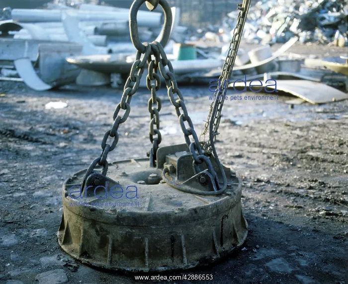 : Industrial magnet in scrapyard : Industrial magnet in scrapyard