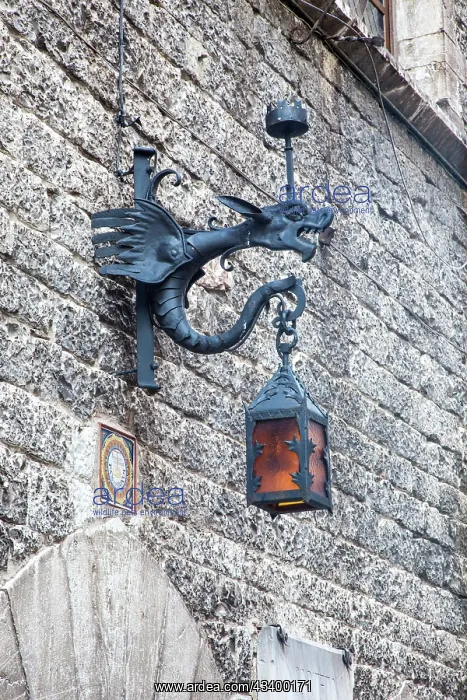 : Italy, Umbria, Assisi. Old stone wall with Dragon Lantern : Italy, Umbria, Assisi. Old stone wall with Dragon Lantern