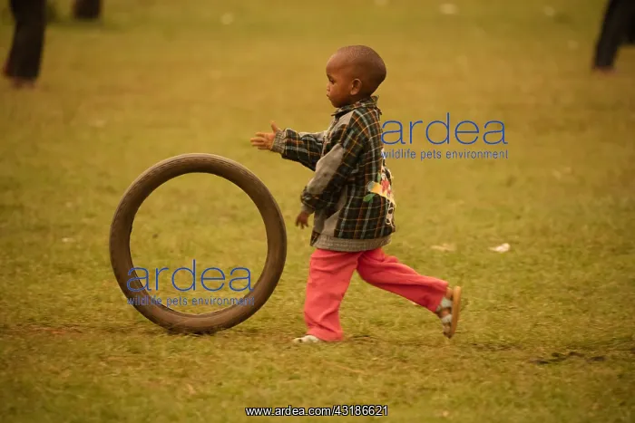 : Kalenjin boy, playing with tire, near Eldoret, Rift : Kalenjin boy, playing with tire, near Eldoret, Rift