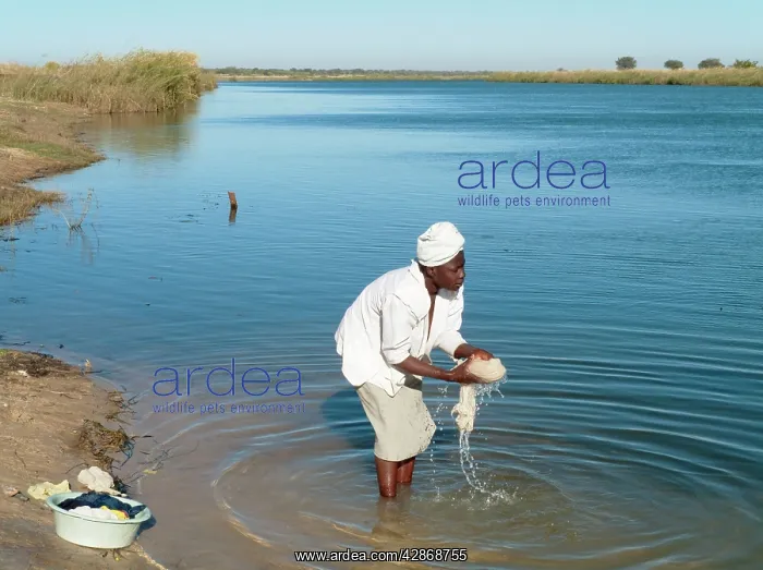 : Kavango woman washing clothes at the Namibian side : Kavango woman washing clothes at the Namibian side
