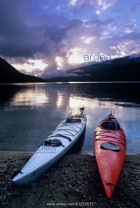 : Kayaks at sunset on Rainbow Falls Beach : Kayaks at sunset on Rainbow Falls Beach