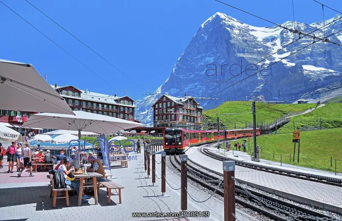 : Kleine Scheidegg with restaurant terrace and Jungfrau : Kleine Scheidegg with restaurant terrace and Jungfrau