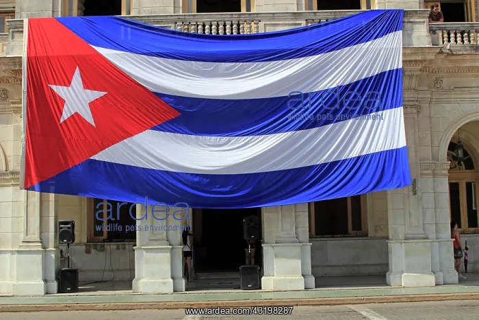 : Large Cuban flag, hangs from building, Santa Clara : Large Cuban flag, hangs from building, Santa Clara