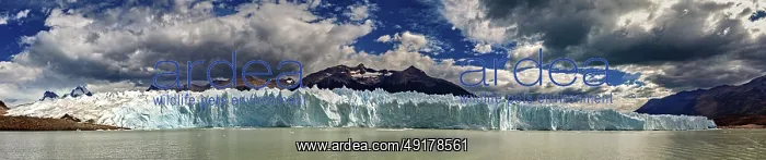 : Large-scale panorama of a distant glacier with draped clouds and mountains : Large-scale panorama of a distant glacier with draped clouds and mountains