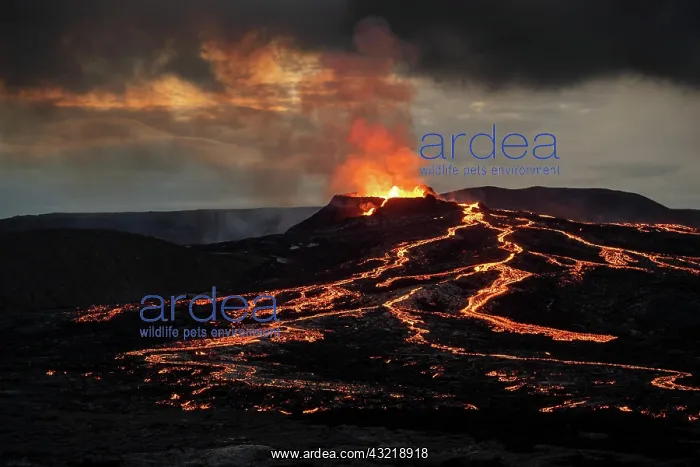 : Lava spurting out of crater and reddish illuminated : Lava spurting out of crater and reddish illuminated