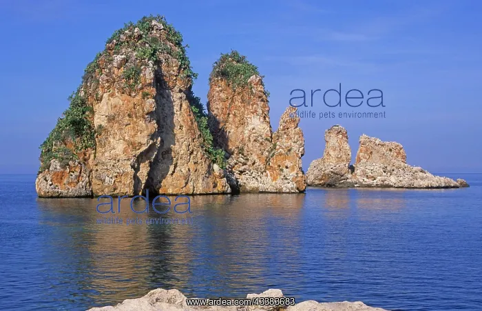 : Limestone rock stacks stand in blue Tyrrhenian sea : Limestone rock stacks stand in blue Tyrrhenian sea