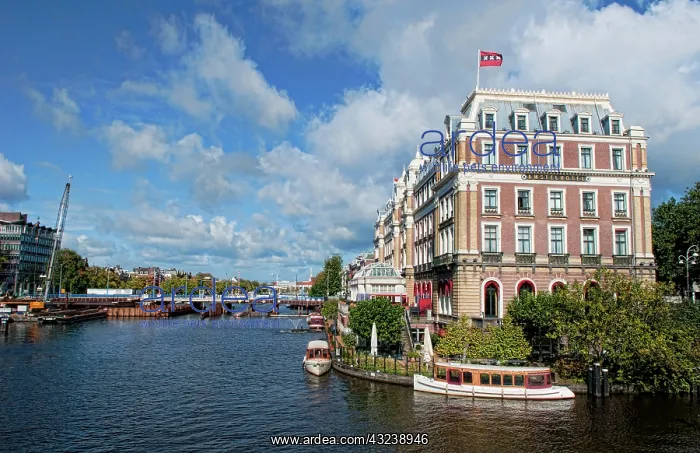 : Local working boats on the canals in Amsterdam : Local working boats on the canals in Amsterdam