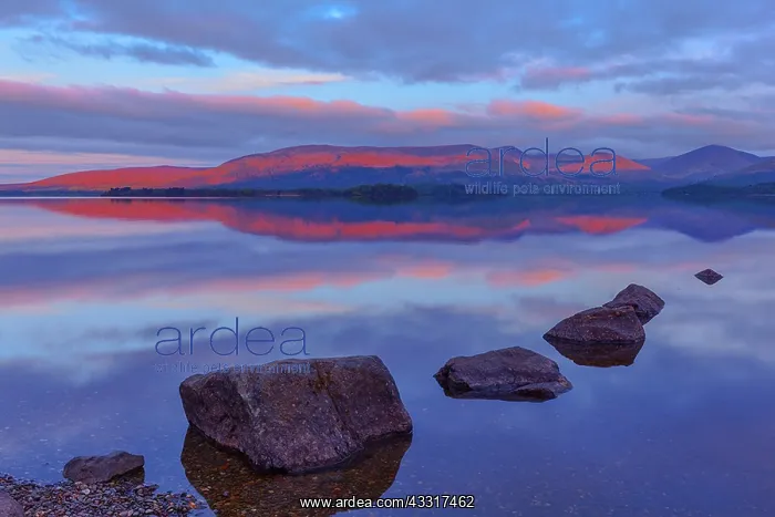 : Loch Lomond - very first sun on mountain range and : Loch Lomond - very first sun on mountain range and