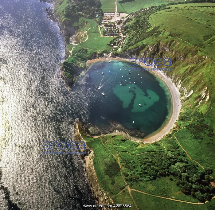 : Lulworth Cove, a natural landform harbour, near : Lulworth Cove, a natural landform harbour, near