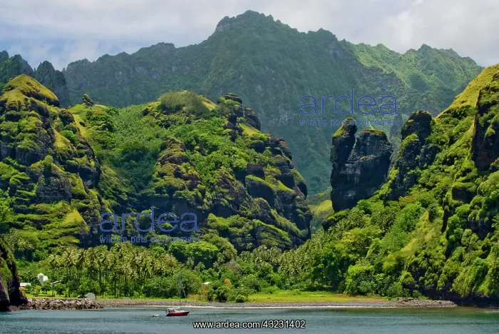 : Lush island greenery at boat approach, Hana : Lush island greenery at boat approach, Hana