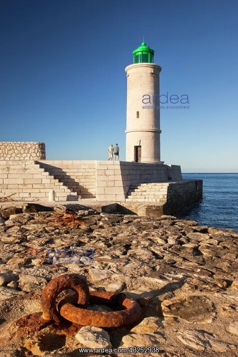  : Two men walking below the Cassis Lighthouse