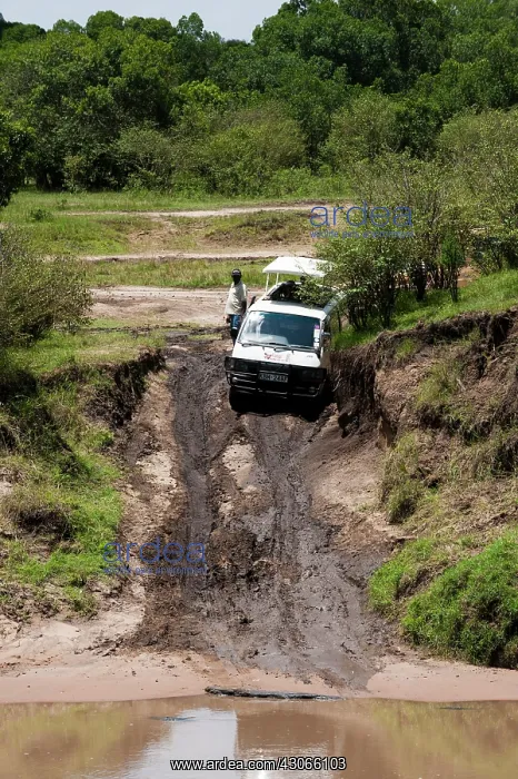 : Minibus stuck in mud, Maasai Mara, Kenya : Minibus stuck in mud, Maasai Mara, Kenya