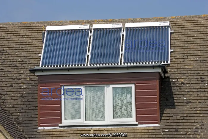 : Modern solar panels on roof of detached house Cotswolds UK : Modern solar panels on roof of detached house Cotswolds UK