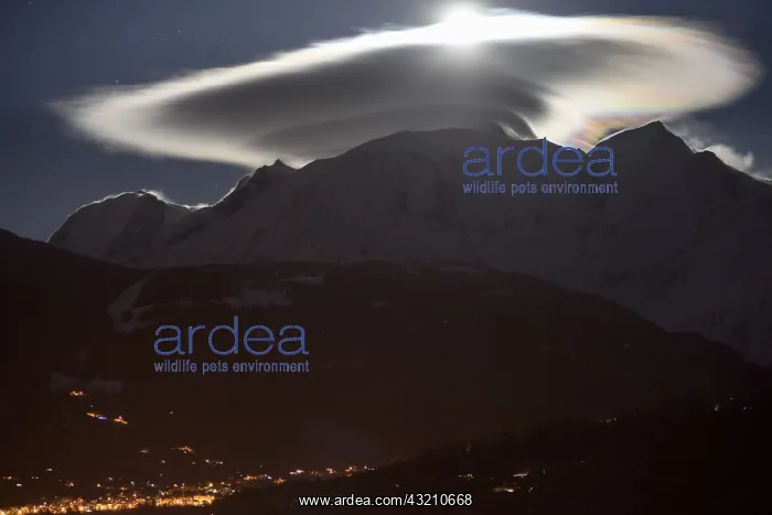 : Mont Blanc massif with cap cloud lit by the moon : Mont Blanc massif with cap cloud lit by the moon