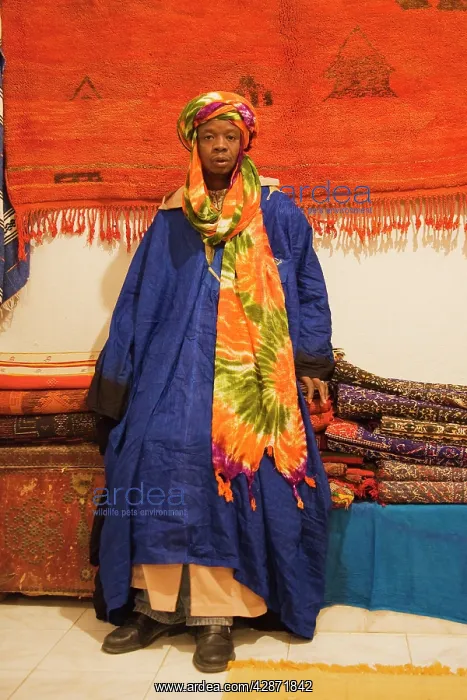 : Morocco - Colourful outfit of an employee in a : Morocco - Colourful outfit of an employee in a