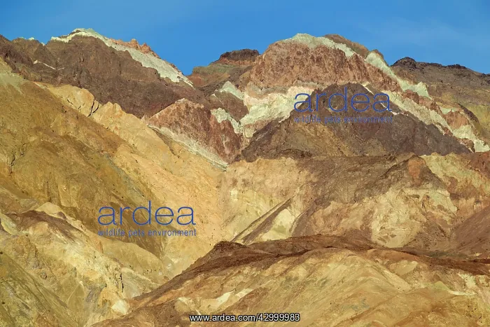 : Multi-hued volcanic and sedimentary rock at the : Multi-hued volcanic and sedimentary rock at the