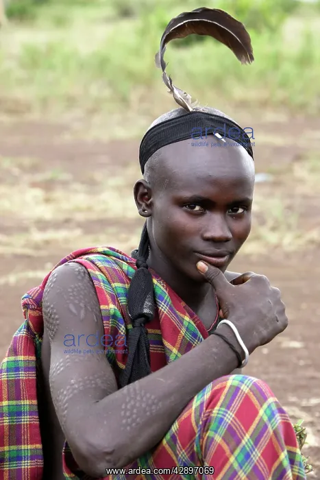 : Mursi people - man with ostrich feather : Mursi people - man with ostrich feather