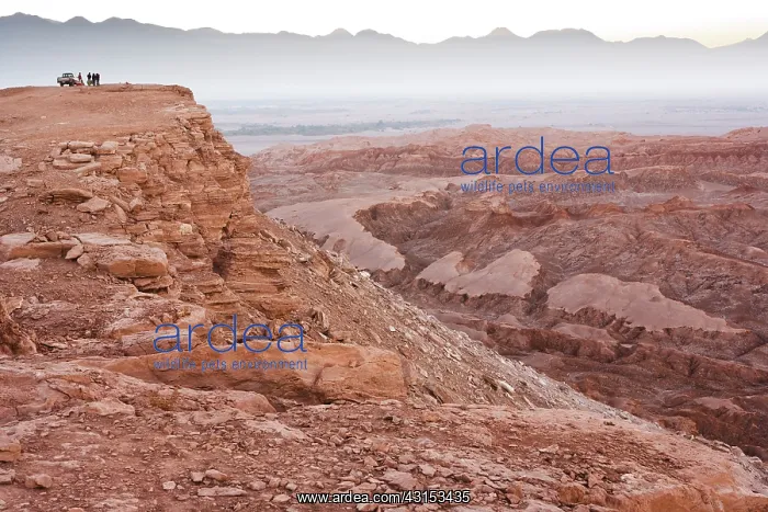 : Near San Pedro de Atacama tourists overlook the Valley of th : Near San Pedro de Atacama tourists overlook the Valley of th