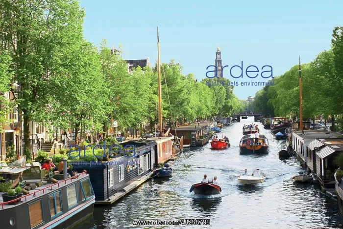 : Netherlands, Amsterdam, Boats cruise along : Netherlands, Amsterdam, Boats cruise along