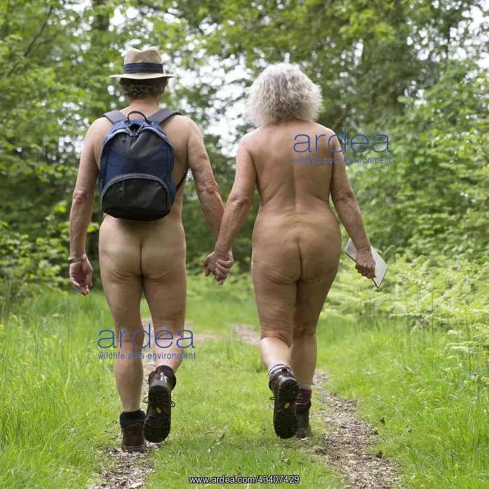  : NUDE. older couple walking in the countryside