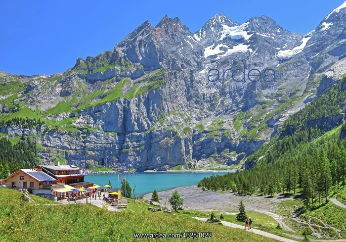 : Oeschinensee with mountain inn and Bluemlisalp : Oeschinensee with mountain inn and Bluemlisalp